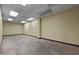Spacious empty room with neutral walls and concrete floors suitable for office or storage space at 1085 Old Us 421, Lillington, NC 27546