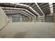 Vast warehouse space with high ceilings, metal racking, and natural light, ideal for storage and operations at 1085 Old Us 421, Lillington, NC 27546