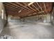 Spacious warehouse with concrete floor, block walls, exposed beam ceiling, and multiple windows at 1085 Old Us 421, Lillington, NC 27546