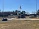 Archer Lodge Town Park ball field with bleachers, walking path and flagpole at 109 Arundel Dr, Archer Lodge, NC 27527
