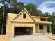 Exterior view of a home under construction, showcasing the raw framing and initial structure at 109 Arundel Dr, Archer Lodge, NC 27527