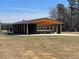 Outdoor pavilion with wooden beams and picnic tables, perfect for gatherings at 109 Arundel Dr, Archer Lodge, NC 27527