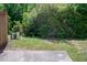 Backyard surrounded by privacy fence and large trees at 1116 Kingston Grove Drive Dr, Cary, NC 27519