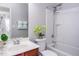Bathroom featuring single sink vanity, toilet, and shower-tub combo at 1116 Kingston Grove Drive Dr, Cary, NC 27519
