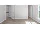 Bright bedroom with ample natural light, hardwood floors, and neutral color palette at 1116 Kingston Grove Drive Dr, Cary, NC 27519