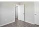 Bedroom featuring hard wood floors and two white doors at 1116 Kingston Grove Drive Dr, Cary, NC 27519
