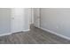 Spacious bedroom with hard wood floors and two white doors at 1116 Kingston Grove Drive Dr, Cary, NC 27519
