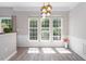 Elegant dining area featuring new floors, large windows, and modern lighting at 1116 Kingston Grove Drive Dr, Cary, NC 27519