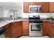 Modern kitchen with stainless steel appliances and functional design at 1116 Kingston Grove Drive Dr, Cary, NC 27519