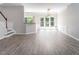 Bright living room featuring fresh paint, new floors, and many windows offering natural light at 1116 Kingston Grove Drive Dr, Cary, NC 27519