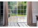 Patio doors that offer abundant natural light and easy access to the outdoor space at 1116 Kingston Grove Drive Dr, Cary, NC 27519