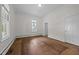 Bedroom features hardwood floors, window with natural light and neutral decor at 112 Rectory St, Oxford, NC 27565
