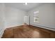 Bedroom featuring hardwood floors, window with natural light and neutral decor at 112 Rectory St, Oxford, NC 27565