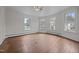 Spacious, light-filled room with hardwood floors and large windows at 112 Rectory St, Oxford, NC 27565