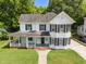 Charming two-story home with a welcoming front porch and well-maintained lawn at 112 Rectory St, Oxford, NC 27565