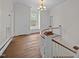 Hallway with beautiful curved railing, window, and multiple doors at 112 Rectory St, Oxford, NC 27565