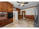 The kitchen features wood cabinets, appliances, and access to adjoining rooms at 112 Rectory St, Oxford, NC 27565