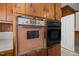 The kitchen features vintage and newer ovens for versatile cooking options at 112 Rectory St, Oxford, NC 27565