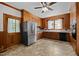 Traditional kitchen featuring wooden cabinets, stainless steel appliances, and tile flooring at 112 Rectory St, Oxford, NC 27565