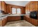 Charming kitchen with wood cabinets, a window over the sink, and a vintage aesthetic at 112 Rectory St, Oxford, NC 27565