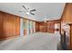 A large living room features a fireplace, shelving, carpeted floors, and lots of natural light at 112 Rectory St, Oxford, NC 27565
