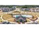 Aerial view of the neighborhood amenities, including the pool, playground, and surrounding homes at 121 Canyon Gap Way, Raleigh, NC 27610