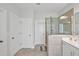 Modern bathroom boasts glass shower, neutral tile, and ample storage at 121 Canyon Gap Way, Raleigh, NC 27610