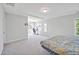 Large bedroom offering natural light and carpet; versatile space with an area for a desk at 121 Canyon Gap Way, Raleigh, NC 27610