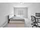 Spacious bedroom with neutral walls, plush carpet, and a bright window at 121 Canyon Gap Way, Raleigh, NC 27610