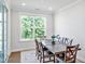 Dining room with large table, seating for six and lots of natural light at 121 Canyon Gap Way, Raleigh, NC 27610