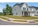 Lovely home with siding exterior, well-maintained lawn, and manicured flowerbeds enhancing its curb appeal on corner lot at 121 Canyon Gap Way, Raleigh, NC 27610