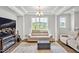 Inviting living room with hardwood floors, recessed lighting, large windows, and a stylish coffered ceiling at 121 Canyon Gap Way, Raleigh, NC 27610