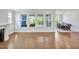 Bright room with large windows, fireplace and view into dining area at 121 Canyon Gap Way, Raleigh, NC 27610
