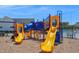 A colorful playground area for with slides and climbing structures in a secure, fenced environment at 121 Canyon Gap Way, Raleigh, NC 27610