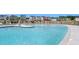 A large community pool with ample lounge chairs, a splash umbrella, and a resort-like atmosphere at 121 Canyon Gap Way, Raleigh, NC 27610
