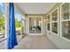 Screened porch with view of the dining room through the sliding glass doors at 121 Canyon Gap Way, Raleigh, NC 27610
