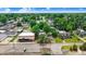 Aerial view showcasing a mixed-use neighborhood with businesses and residences at 125 W Pine St, Pine Level, NC 27568