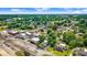 Picturesque aerial view of a property with mature trees and a quaint neighborhood setting at 125 W Pine St, Pine Level, NC 27568
