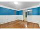 Spacious bedroom with hardwood floors, wainscoting, and ample closet space at 125 W Pine St, Pine Level, NC 27568