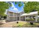 Two-story home featuring a carport, exterior staircase to the upper level, and a well-maintained lawn at 125 W Pine St, Pine Level, NC 27568