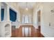 Elegant living room features hardwood floors, decorative columns, and a chandelier at 125 W Pine St, Pine Level, NC 27568