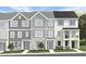 Charming townhome exteriors showcasing a variety of attractive facades, landscaping, and inviting entryways at 1416 Jay Rd, Knightdale, NC 27545