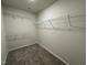 The closet features carpet and several rows of wire shelving for optimal storage and organization of personal belongings at 175 Oakfield Trace Dr, Four Oaks, NC 27524