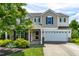 Charming two-story home with a two-car garage, stone accents, and inviting curb appeal at 2011 Unbridled Dr, Knightdale, NC 27545