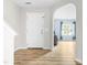 Inviting foyer with modern flooring and an arched entryway to the living spaces at 2011 Unbridled Dr, Knightdale, NC 27545