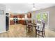 Spacious kitchen with dark cabinets, modern appliances, and a breakfast nook at 2011 Unbridled Dr, Knightdale, NC 27545