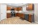 Bright kitchen featuring modern appliances, wooden cabinets, and plenty of counter space at 2011 Unbridled Dr, Knightdale, NC 27545