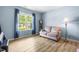 Cozy living room with natural light and comfortable seating, ideal for relaxation at 2011 Unbridled Dr, Knightdale, NC 27545