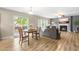 Open living area with a dining table and access to the backyard patio at 2011 Unbridled Dr, Knightdale, NC 27545