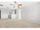 Loft area with neutral carpet, ceiling fan, fresh paint, and several doorways at 2011 Unbridled Dr, Knightdale, NC 27545